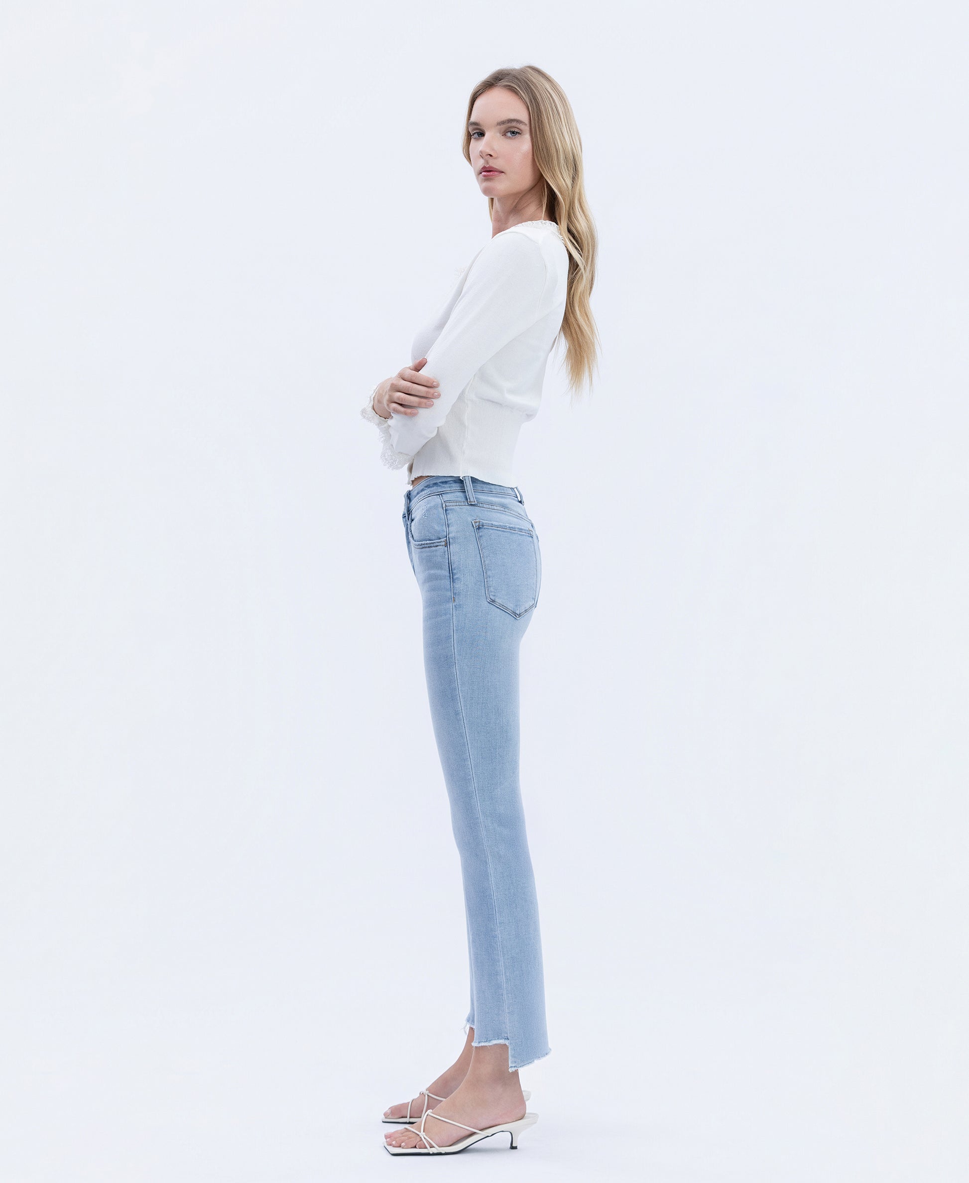 Left side product images of Striving - High Rise Raw Step Hem Crop Flare Jeans