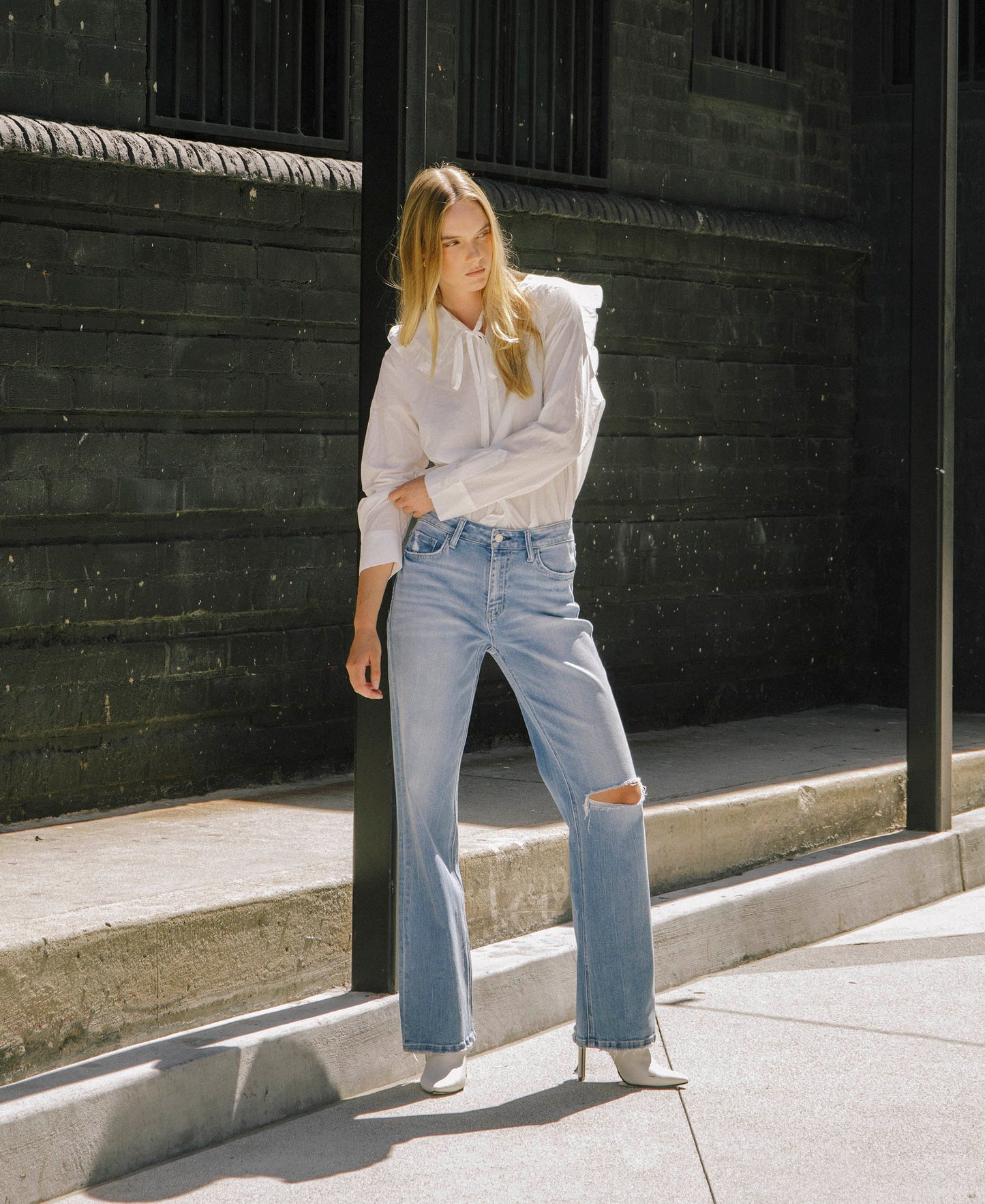 editorial image of Literary - High Rise Distressed Slim Wide Jeans