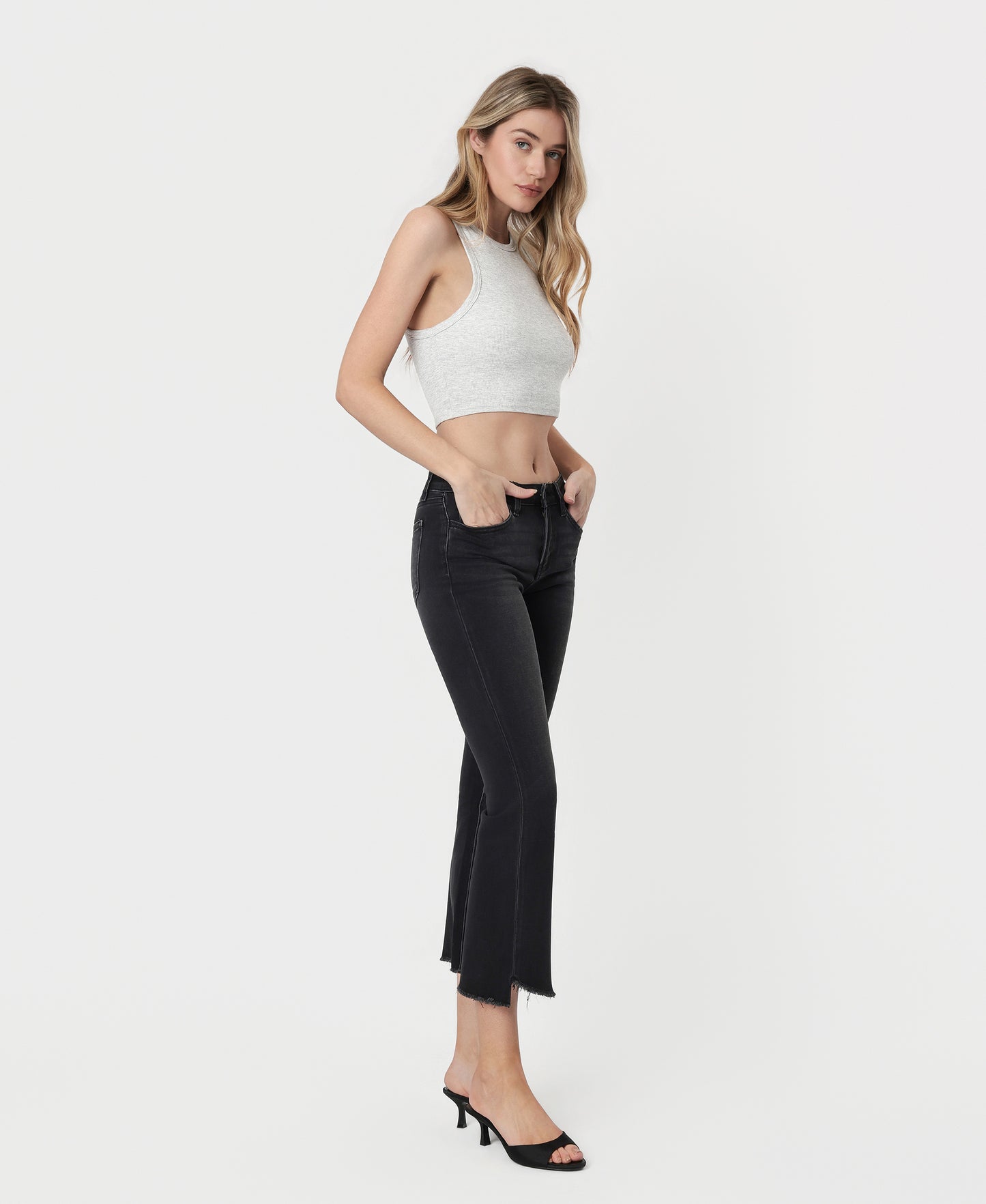 Right 45 degrees product image of Black - Mid Rise Raw Step Hem Crop Flare Jeans