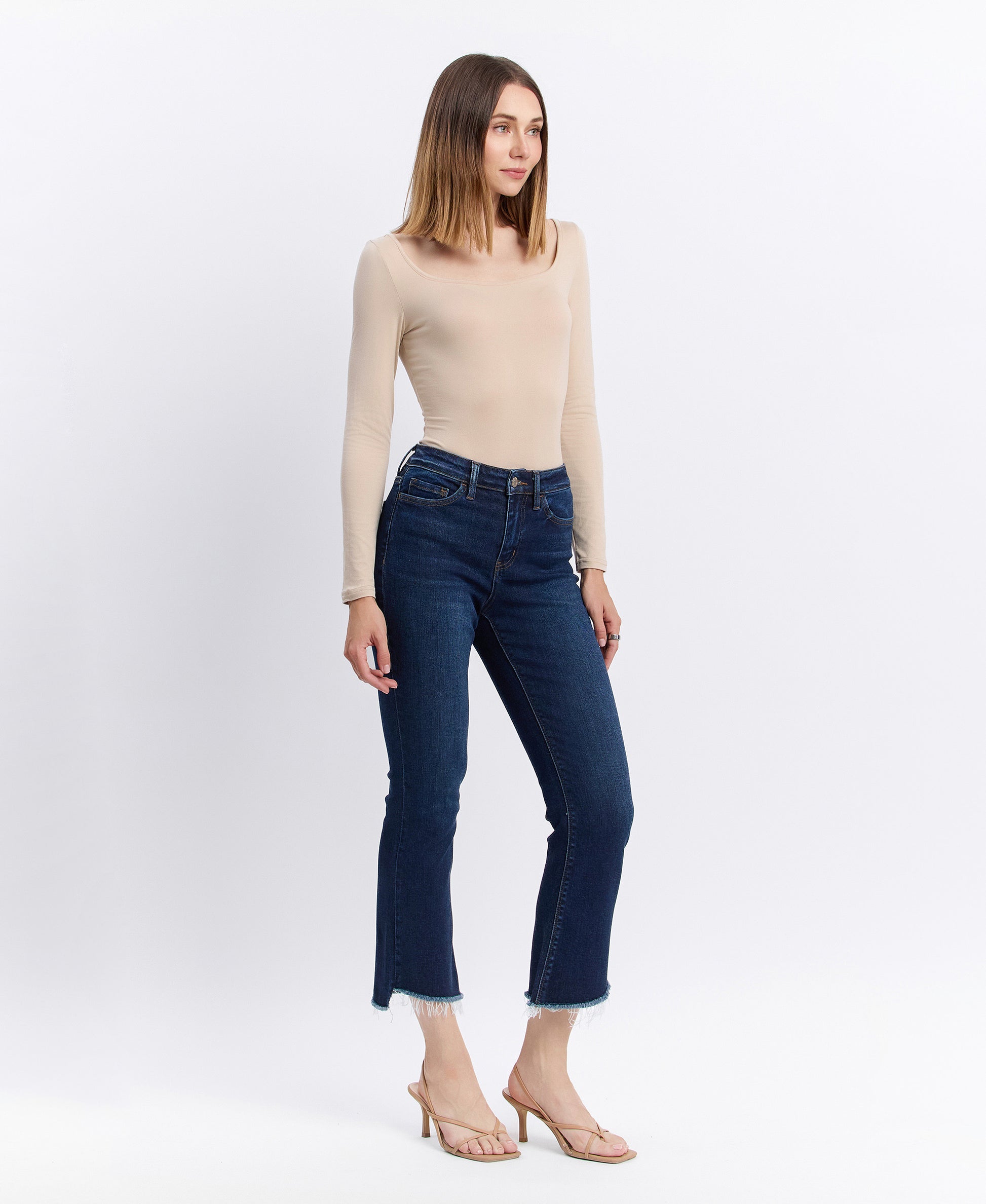 Right 45 degrees product image of Motivated - High Rise Step Raw Hem Crop Flare Jeans