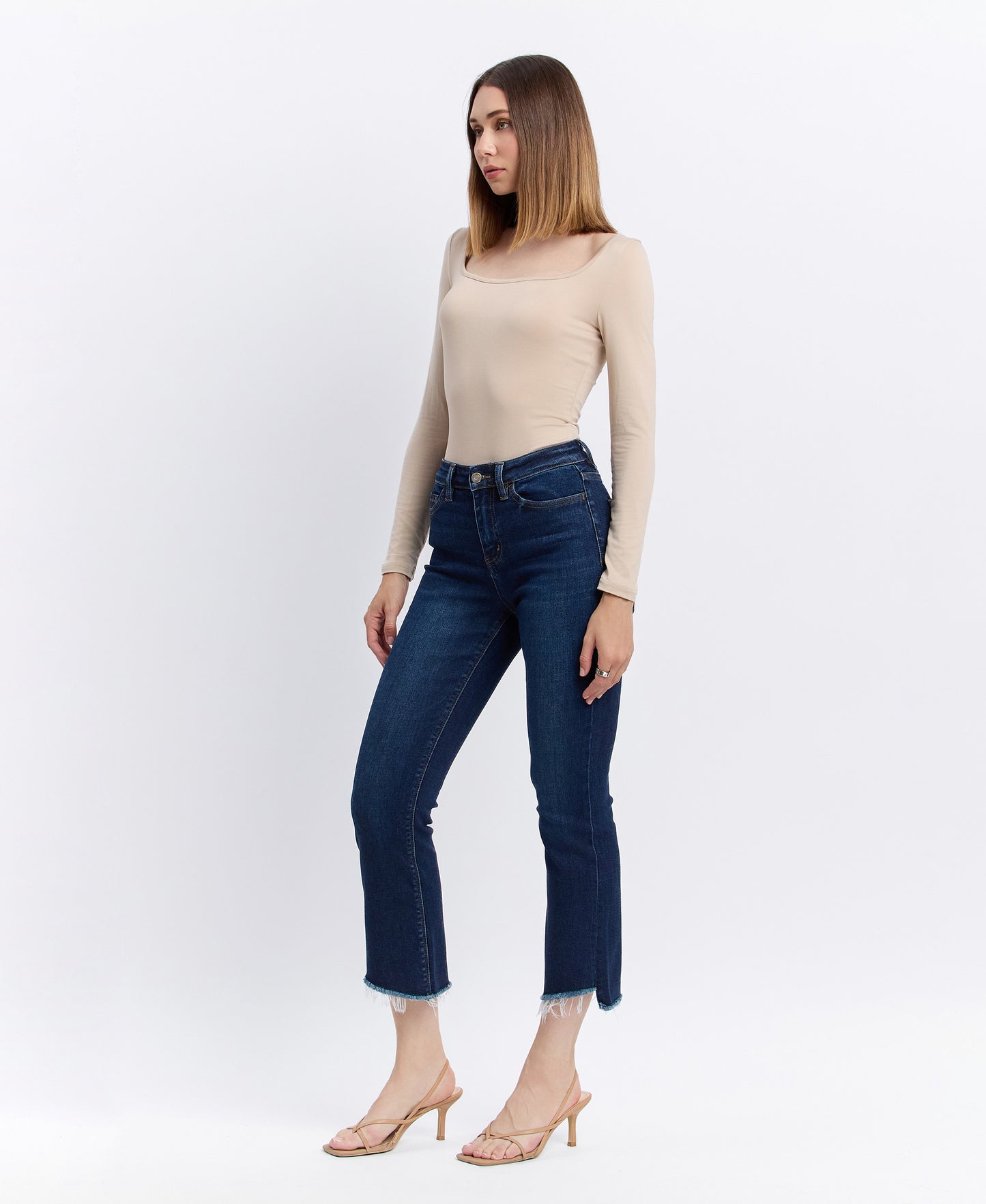 Left 45 degrees product image of Motivated - High Rise Step Raw Hem Crop Flare Jeans