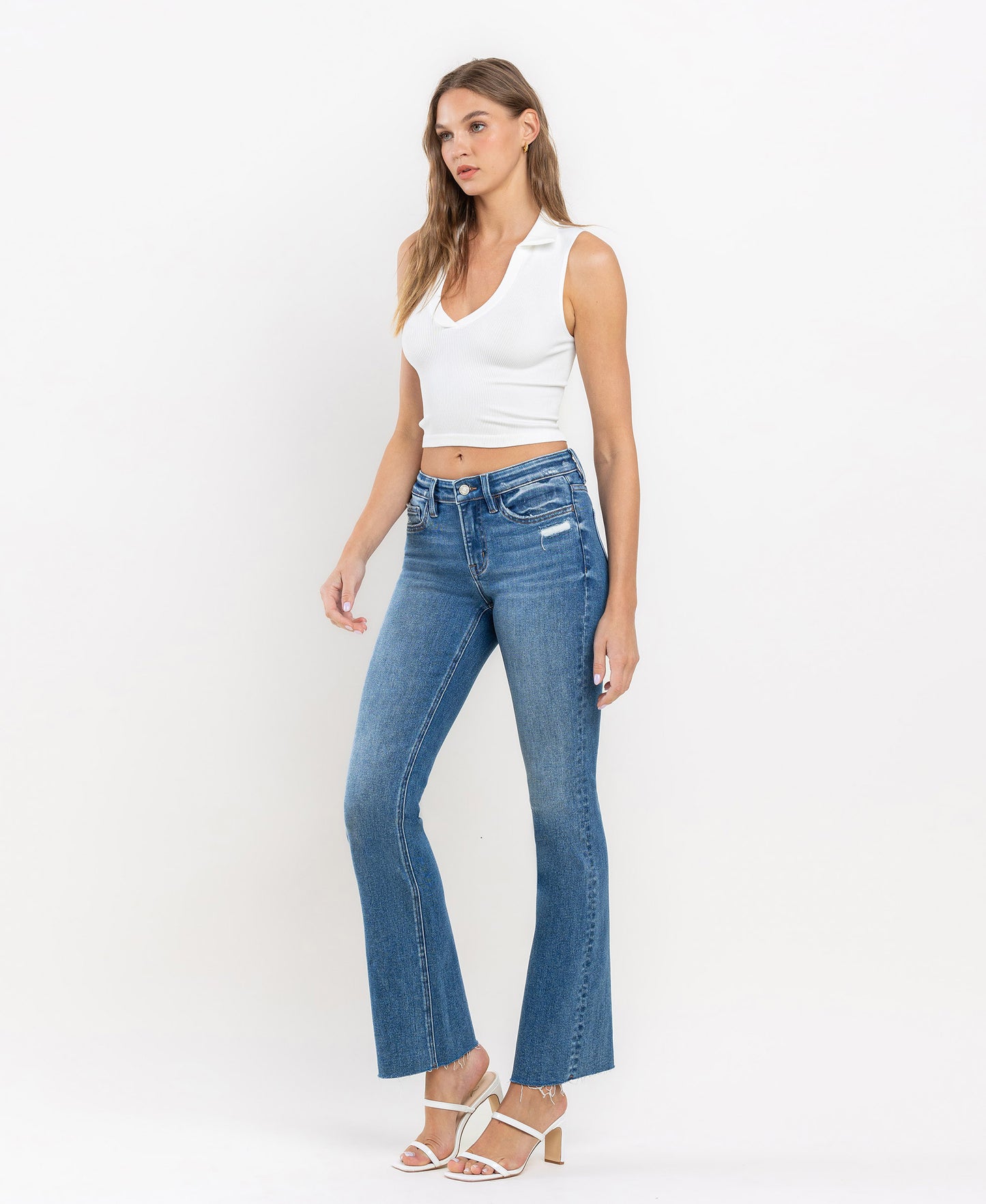 Left 45 degrees product image of Well Rounded - Mid Rise Raw Hem Ankle Bootcut Jeans