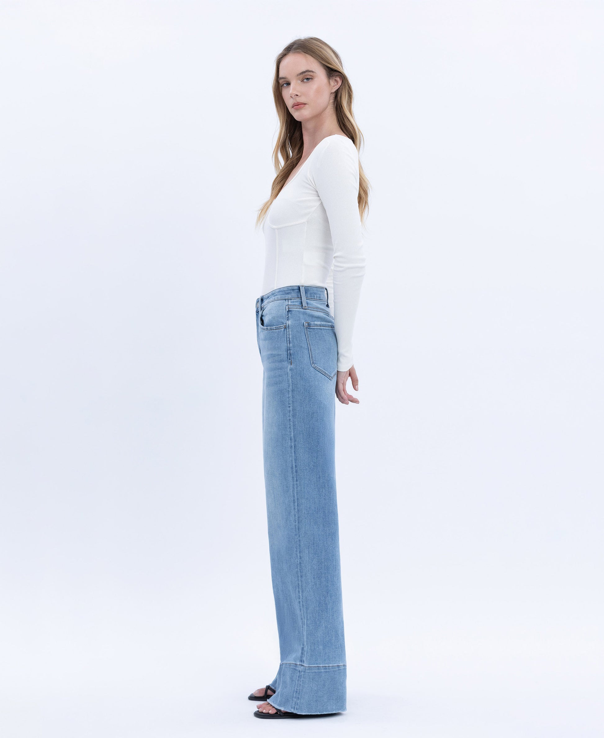 Left side product images of Legitimate - High Rise Raw Hem A-Line Wide Leg Jeans
