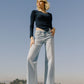 Lifestyle image of Judy - High Rise Raw Hem Wide Leg Jeans