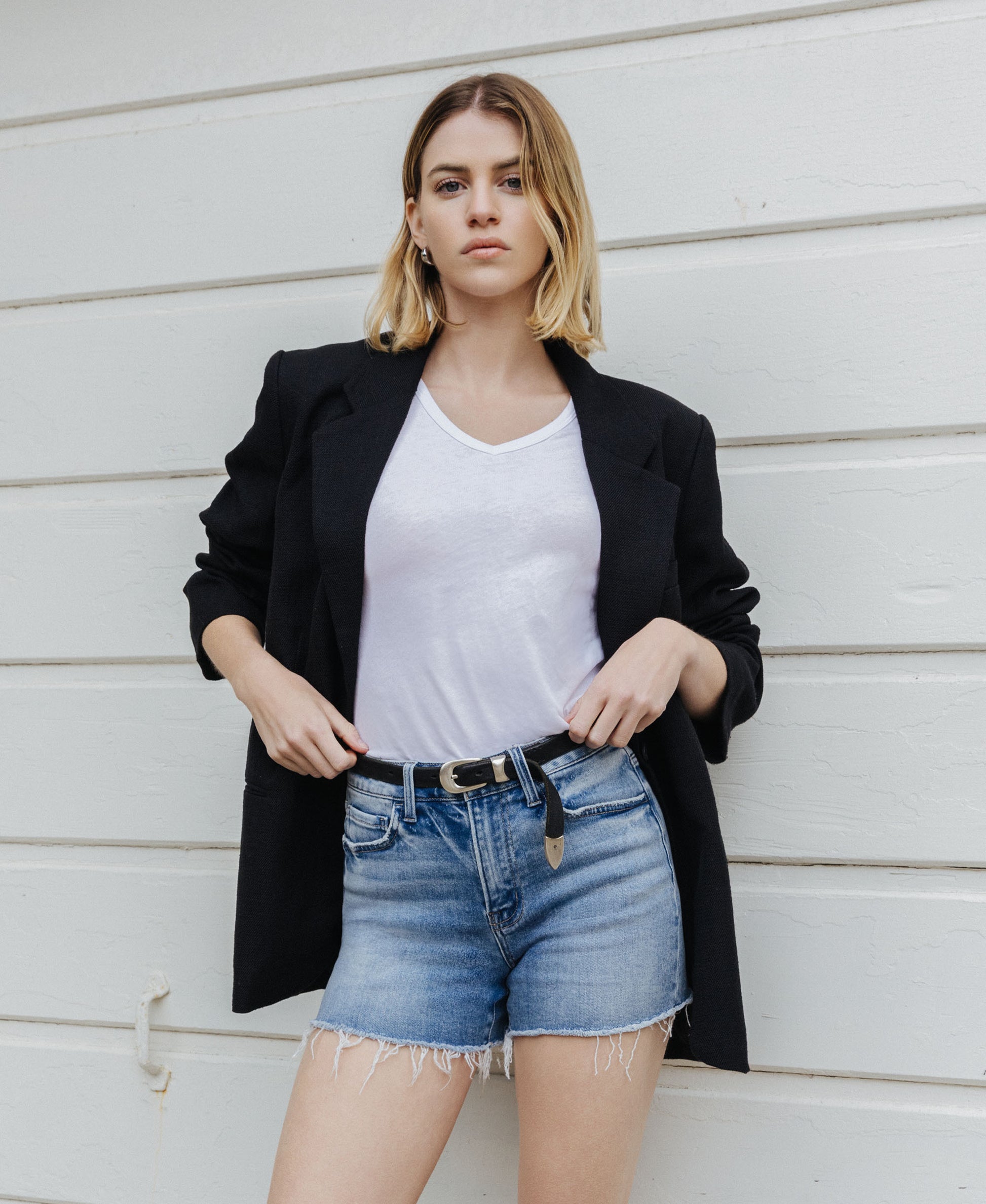 editorial image of 
Riptide - High Rise Raw Hem Relaxed Denim Shorts