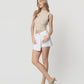 Left 45 degrees product image of Optic White - High Rise Raw Hem Denim Skorts
