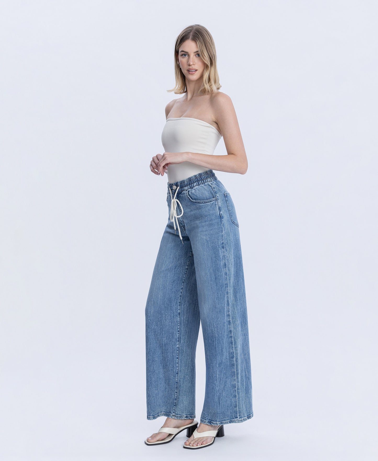 Left 45 degrees product image of Vibrant Essence - Super High Rise Elastic Waistband Wide Leg Jeans