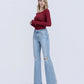 Left 45 degrees product image of York - High Rise Distressed Easy Flare Jeans