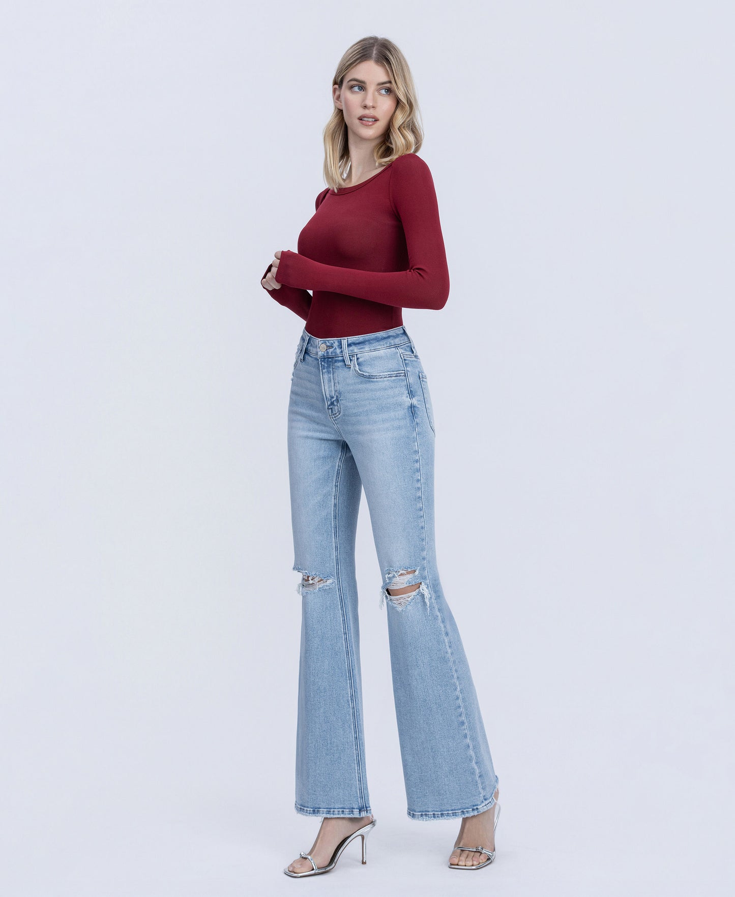 Left 45 degrees product image of York - High Rise Distressed Easy Flare Jeans