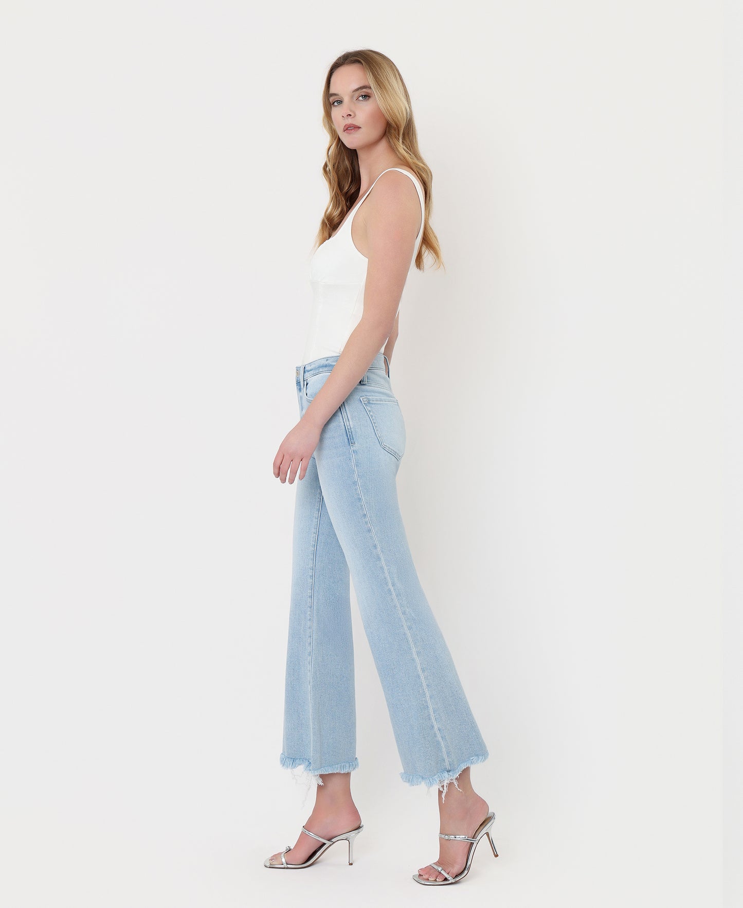 Left side product images of Charm - High Rise Uneven Frayed Hem Crop Easy Flare Jeans
