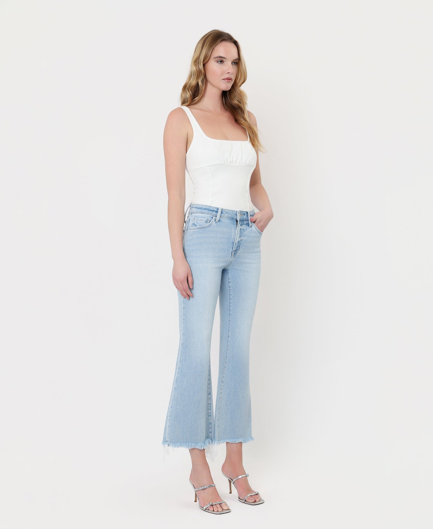 Right 45 degrees product image of Charm - High Rise Uneven Frayed Hem Crop Easy Flare Jeans