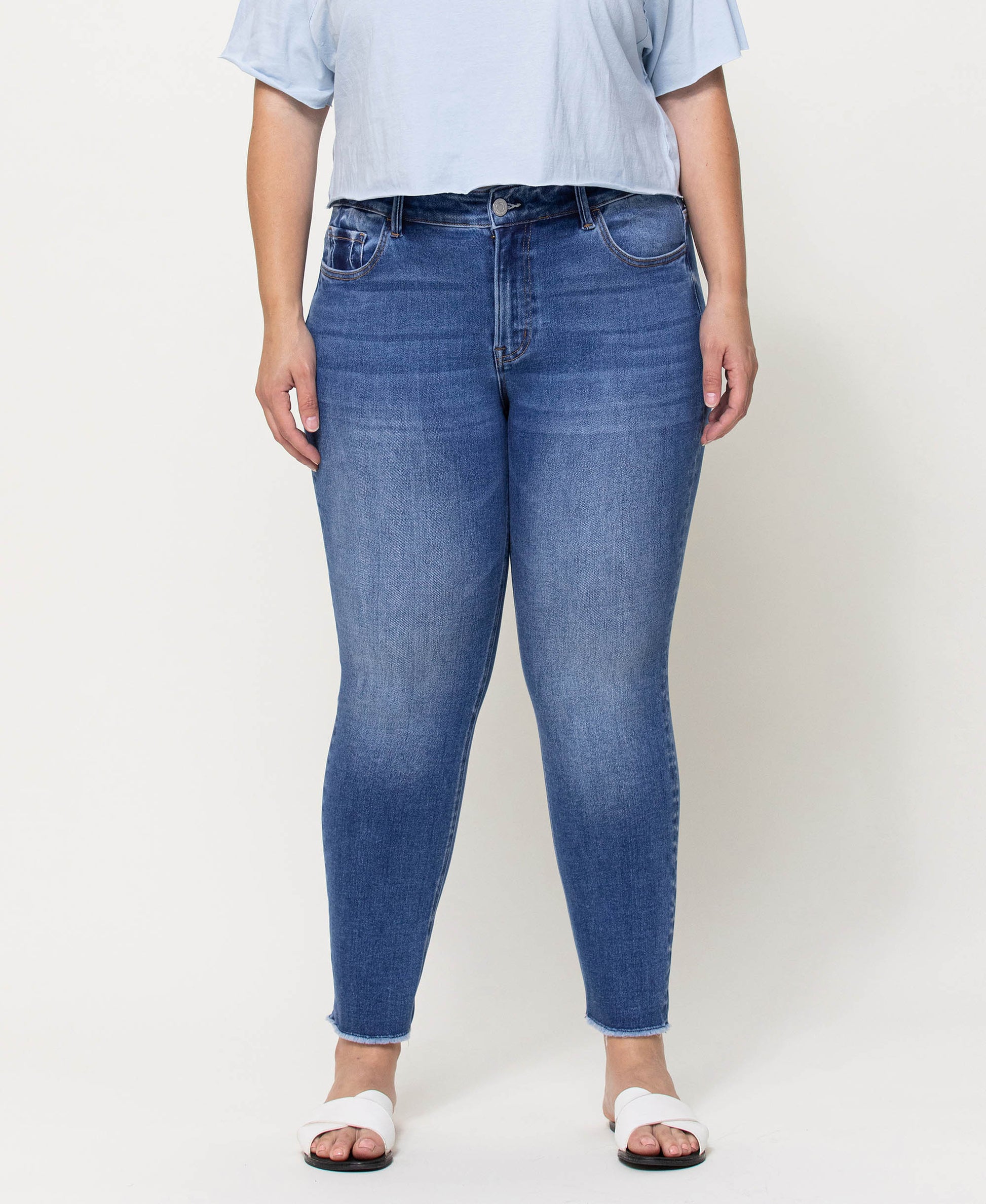 Front product images of Wolf N Crane - Plus Mid Rise Raw Hem Crop Skinny Jeans