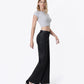 Right 45 degrees product image of Black - High Rise Trouser Hem Coated Wide Leg Jeans